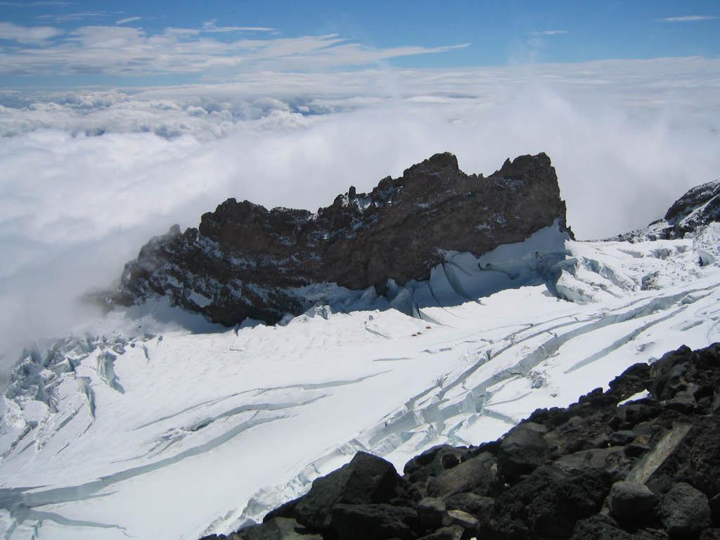 23 Aug. 2004, 12:31pm, on Disappointment Cleaver. This photo is taken on the lower part of Disappointment Cleaver, looking across the Ingraham Glacier toward Cathedral Rocks.