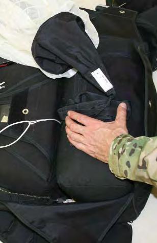 3.8.4. Place the kicker sub flap connected to flap-1, over the main deployment bag. S-fold the entire main parachute bridle to a width of 8 ± 1. Place it on top of the sub flap. 3.8.5.