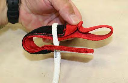 DO NOT pass through the locking loop. 2.3.17. Thread a piece of waxed nylon tack cord through the steering line loop. Put both ends of the tack cord through the toggle grommet from the Velcro side.