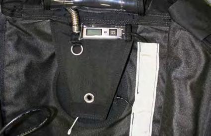 2.5.21. Fully insert the control unit inside the pocket. Confirm visibility.