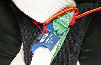 2.9.10. Secure the red lanyard to the Skyhook by using a safety tie. Use one turn of seal thread (4-6 lb.