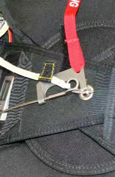 2.9.25. Insert the closing pin through the Marine eye located at the terminal end of the reserve ripcord cable.