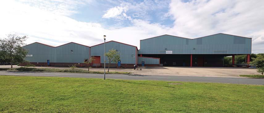 The warehouse comprises two main areas with the high-bay area having a minimum eaves height of 10.5m (34ft) and a dedicated canopied loading area to the south.
