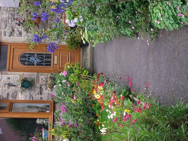 HeLP Heptonstall Lights & Planting group SUMMER FRONT OF HOUSE COMPETITION was won by this lovely display at 35,