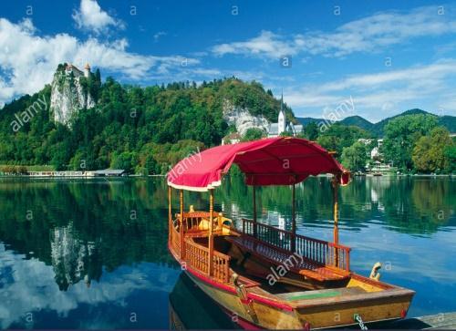Take a walk around Lake Bled and a trip across the lake in the traditional Pletna boat - a wooden flat-bottom boat.