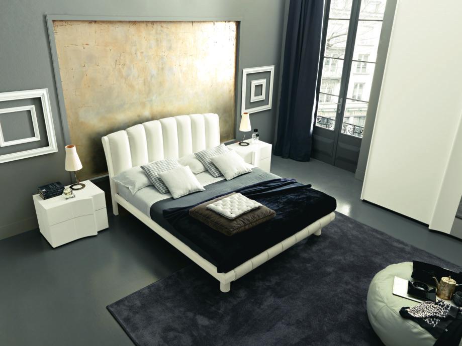 Armonia bed upholstered in eco-leather and bianco ash (A bedframe) with footboard and cushion with the same finish.