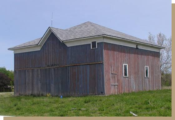 The large barn (far left) was the cow barn and the smaller one (upper left) was the horse barn.