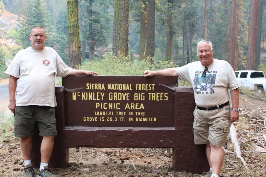 , near the south end of the Dusy Trail, the group stops to take in this grove of Giant Sequoias. One of the last of the Dusy Ershim s trail builders, John Skadden with his daughter Sue.
