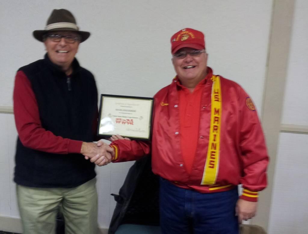 m. Pictured is your HGS President Rudy Andrews receiving an Award of Recognition for our kd contribution to Toys for Tots, from Tony Anthony of the Marine Corp League.
