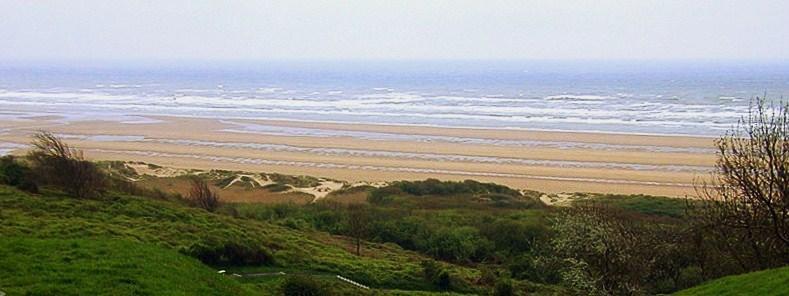Omaha Beach as the Germans saw it. Above left: Pointe du Hoc, with bomb craters still visible.