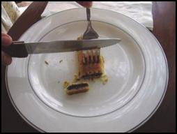 if left handed. Slide the fork over the food a bite-sized amount, and pierce the food with the fork.