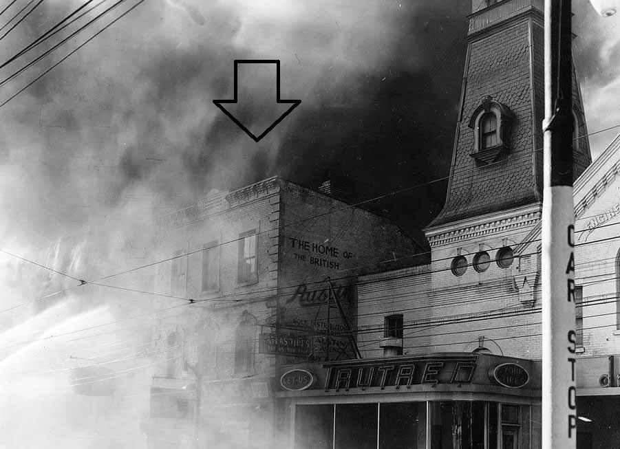 16. Archival Photograph, 480 Yonge Street, 1941: showing the subject building during the fire at the neighbouring Lyon's