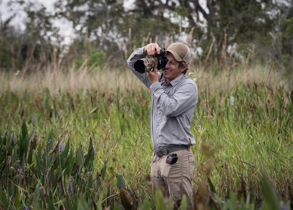 Photo 4: Carlton Ward at work photographing wildlife research on Buck Island Ranch, a