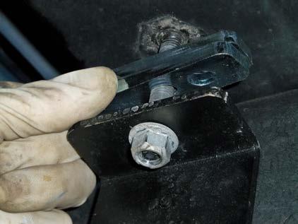 (Fig. 8) Thread two shims onto each strap bolt. (Fig. 9) Tighten the bolt and bracket against the shims.