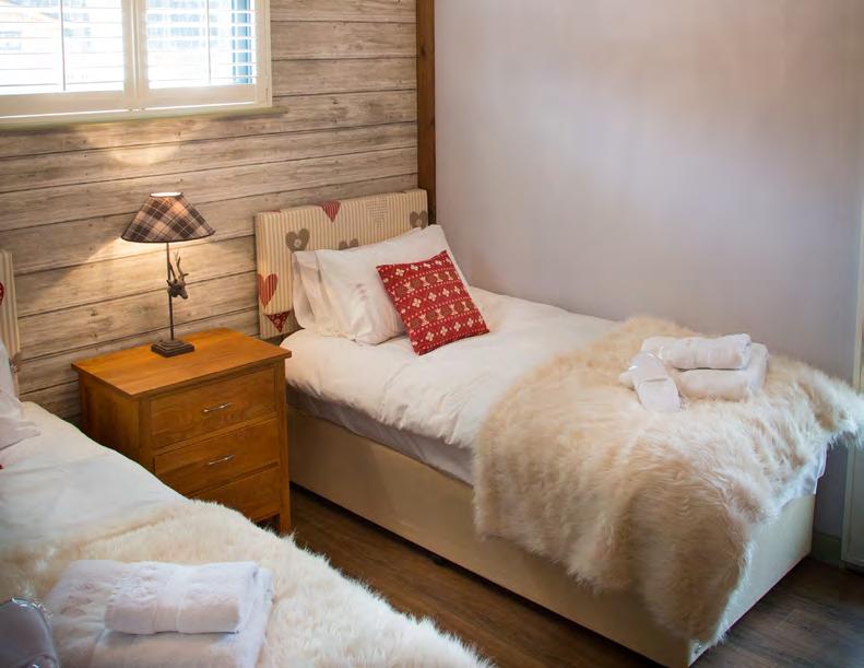 WOODLAND RUSTIC Our standard woodland lodges have a homely style with forest views.