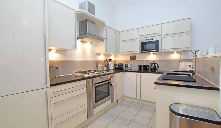 welcoming reception hall with storage off; lovely main living/dining room, open plan kitchen with direct access to a