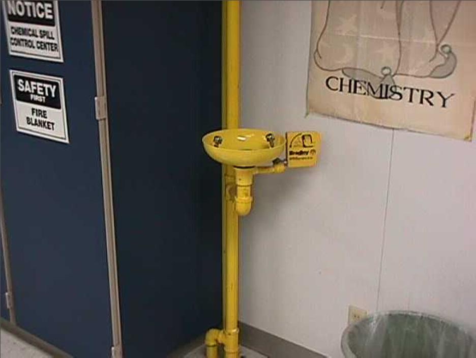 The Eyewash Station is located in the back of the lab, next to the Safety Cabinet and under the Safety Shower.
