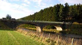 HB12 Bridge of Buchaam A Bridge for the Landed Gentry Grid Ref: NJ 3909 1281 // Postcode Boundary: AB36 8TL The long graceful lines of Buchaam Bridge are testament to the baronial ambitions of the