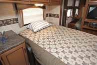 located above the queen size bed in the