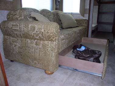 SECTION 8 CAMPING & OPERATING HIDE-A-BED SOFA WITH AIR MATTRESS seat cushion to access the storage area underneath.
