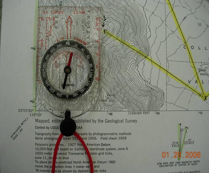 Step 4. Grab corner of map and move until magnetic needle of compass is about 13 to the right of the Arrow Box. The map is now oriented.