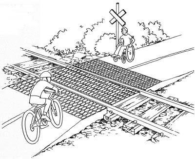Figure 12. Railroad Approach with Rubberized Pads Crossing the actual railroad track can also pose a potential threat to pedestrians, especially those who use wheel based equipment.