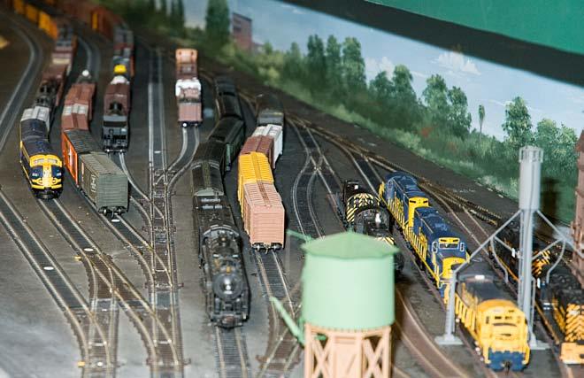 This large HO-scale layout is dedicated to operations, complete with an office for the dispatcher, who sits in front of a computer screen directing the traffic.