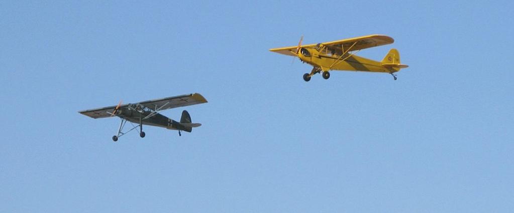 Photo by Paul Rohdes Bernie Gross in his Storch and Curtis Clark in his Cub on a Lowspeed Flyby Yak Line at the Copperstate Fly-In Photo by Ron Kassik Thunderbird Field EAA