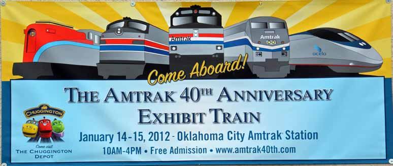 BNSF freight train passes the Amtrak 40th anniversary train