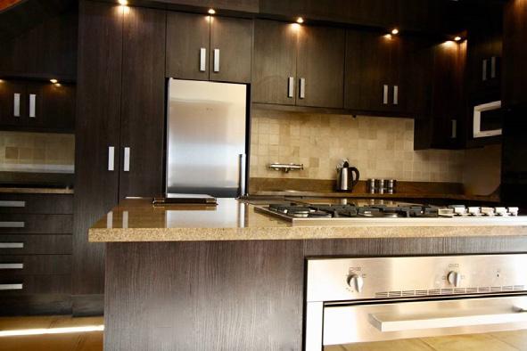 THE KITCHEN: Our fully equipped gourmet kitchen has an easy to use open plan layout and encourages social kitchen gatherings.