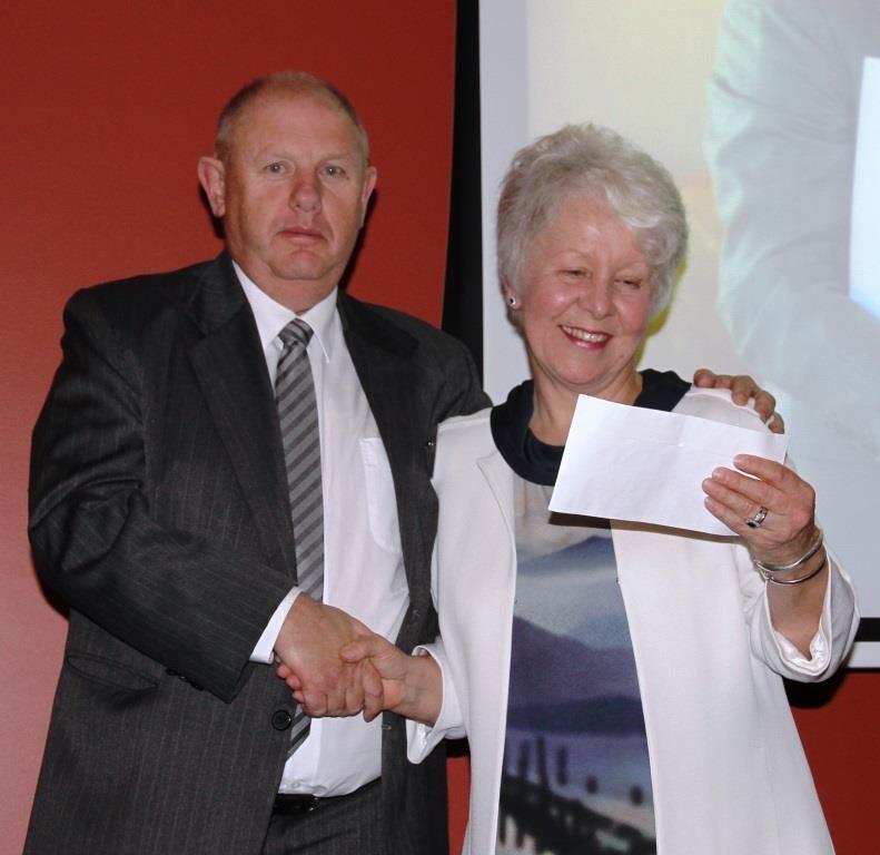 presented the first of 3 cheques for $15,000 to recent past Chair of the Alkira Board, June Charlesworth (photo right).