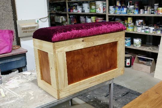 Refurbished Blanket Box This beautiful blanket box was restored by Tom Skinner and is waiting at the paint area for finishing. The velveteen material for the top was supplied by the customer.
