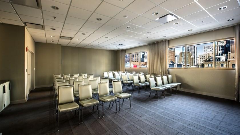 The Hoffman room features natural light from the west and north. Digital signage may be customized with consultation.