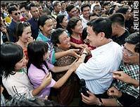 Thailand s Previous PM Pol Col Thaksin Shinwatra during Feb 9, 01 to Sept. 06 Thanksinomic core is populist economic policies designed to increase the purchasing power of Thailand s rural lower class.