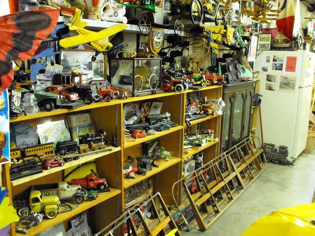Toys and collectables fill a couple of shelves in their hangar.