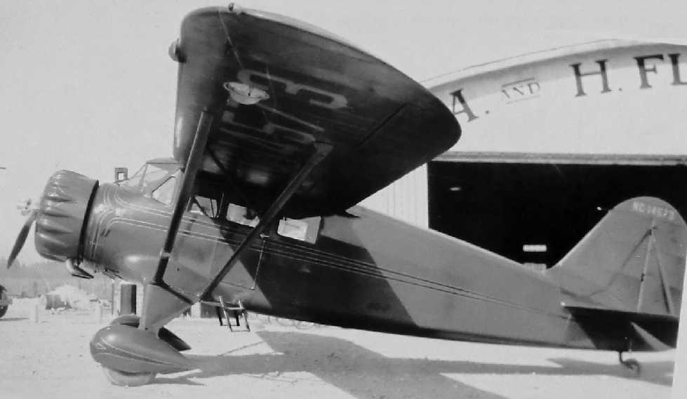 A photo (believed to be 1937) of a Stinson Reliant in front of the A&H Flying Service hangar at Asheville-Hendersonville Airport (courtesy of Frank Blazich). According to Mark Hess, Mark Reed.