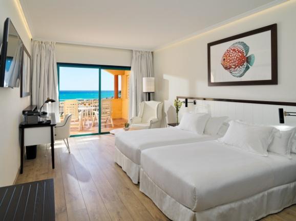They are located on the upper floors of the hotel and have a balcony or terrace with stunning sea views. They feature either one double bed or twin beds.