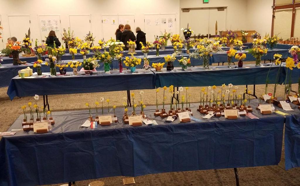 are the girl scouts floral arrangements, the third row of tables are the high
