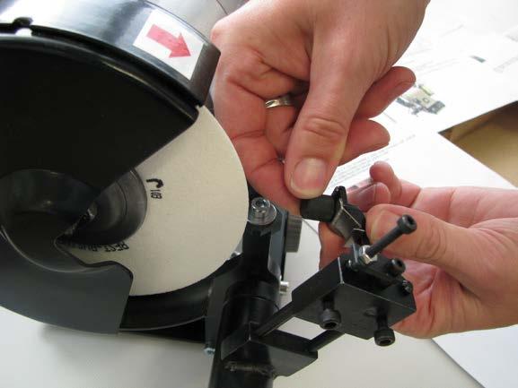 Preparation for sharpening - Loosen the screw M8 by approximately by 4 mm, slightly lift up and turn the dressing wheel holder by 90 ; thus it will be tilted off from the working