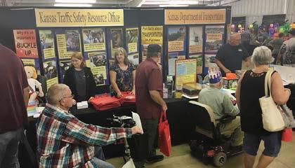 A few people stopping by the booth included KDOT retiree Dennis