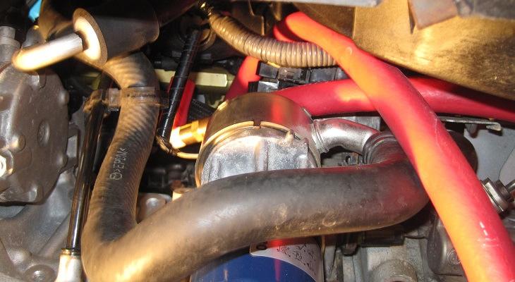 11 Step 6, route and connect new intake manifold hose: Install the hoses with the check valve onto the intake manifold port; the small 2 hose length is what attaches to the manifold.