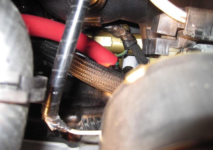8 With the hose fully seated on the PCV valve, use one of the factory hose clamps from earlier, slide it up the hose, to where it s on the PCV valve