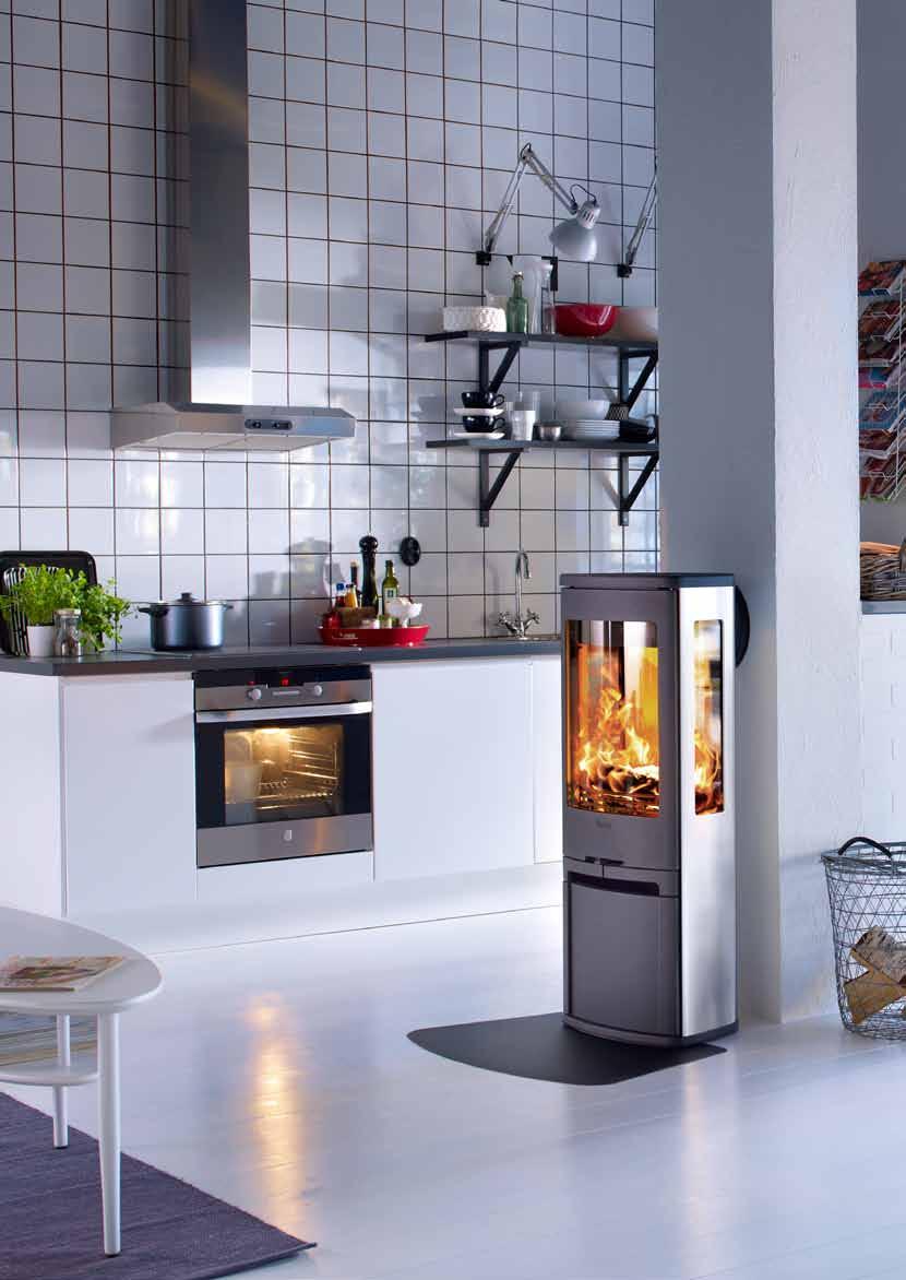 6 We immediately saw that this striking aluminium stove with its large expanses of glass would be perfect in our home.