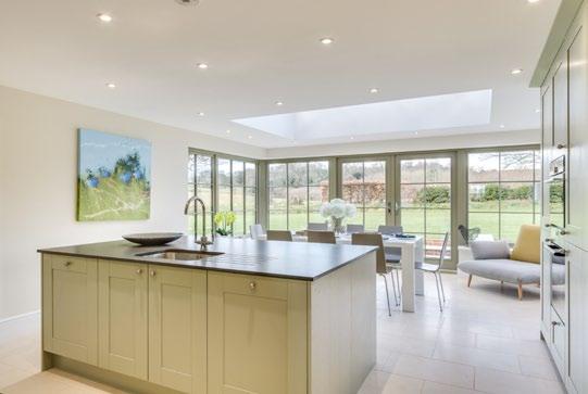 The Orangery opens into a large terraced area with steps to the lawn. Adjoining the kitchen and easily enclosed if desired, lies the south facing family room, snug/ playroom or formal dining room.