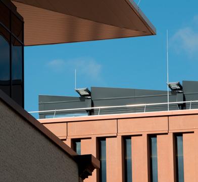 different proceedings with their respective jurisdictions. The unilaterally protruding soffits of the narrow window slots serve as passive sun protection.