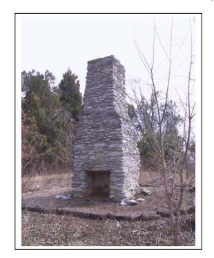 Document 1-Archaeological Investigation A limestone double flue central chimney (See Figure #3), DHR 21-550-18, the remains of a domestic (house like) structure located within the southeast corner of