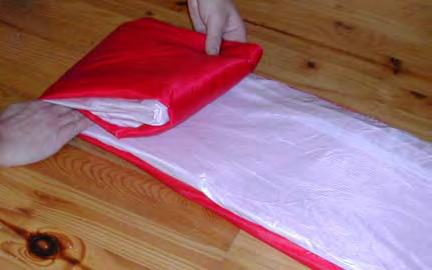 21 >> Carefully fold it again so that the fabric remains evenly