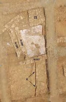 slabs were found inside part of the drain along with pottery dating to the LH IIIA2- IIIB period.