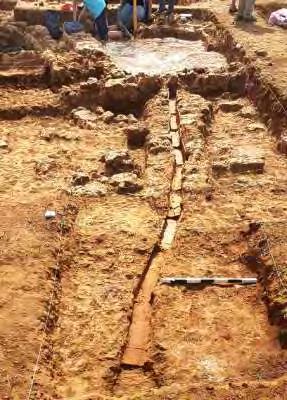A stone platform (Feature A), was uncovered east of the plaster floor with a width of 4.3 m north-south and 3.1 m east-west.
