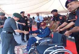 electric wheel chair donated by SBI to a disabled soldier at Pune.
